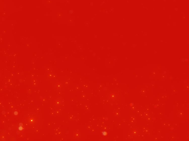 Rotes Hintergrundbild mit kleinen hellen Punkten und Lichtreflexen.
