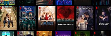 Netflix-Startseite mit verschiedenen Serien- und Filmplakaten, darunter Emily in Paris, Squid Game und Stranger Things.