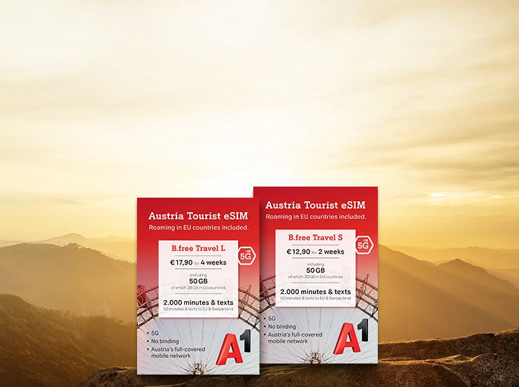 The image shows a mountain landscape in warm hues with two red advertising boards. The left board offers "B.free Travel L" for €17.90 with 50 GB. The right board offers "B.free Travel S" for €12.90 with 50 GB